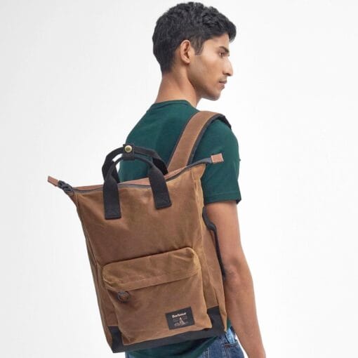 Barbour Field Waxed Backpack in Tan and Black person UBA0714SN911